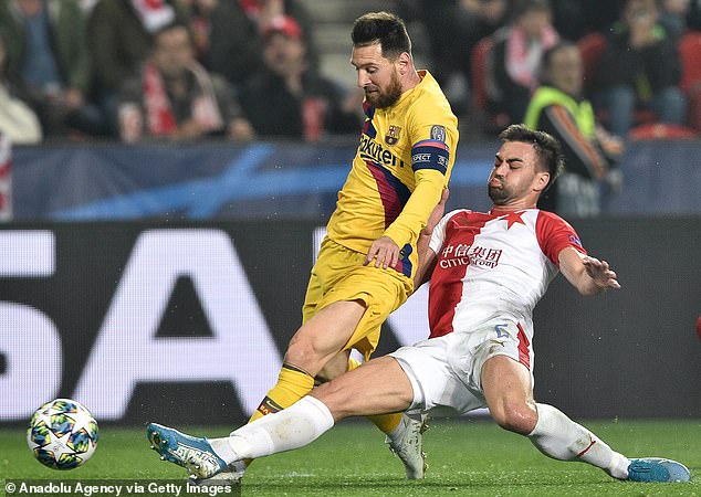Slavia Prague defender David Hovorka (R) tackles Barcelona star Lionel Messi