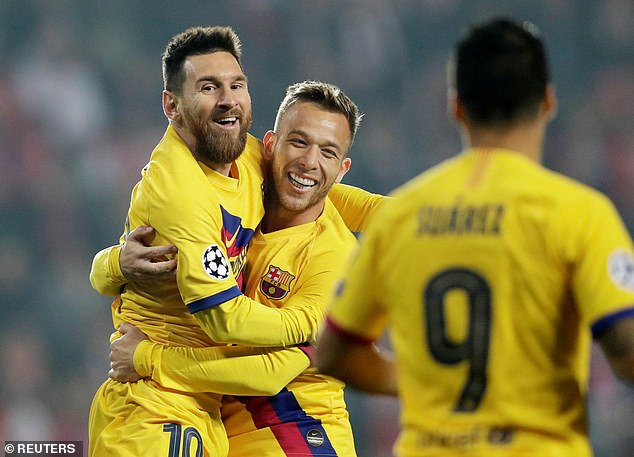Lionel Messi celebrates with Arthur after giving Barcelona the lead at Slavia Prague